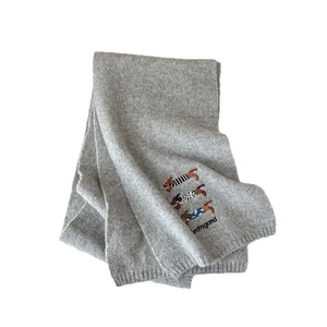 Grey wool knit scarf with dachshund embroidery and textured ribbed edges for winter warmth