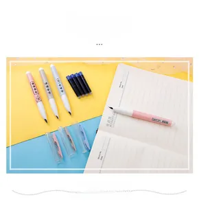 Detail view of four colorful fountain pens with matching blue ink refills and clear caps