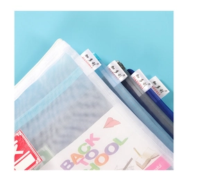 Detail of layered mesh A4 folders with zipper closure and school supply labels