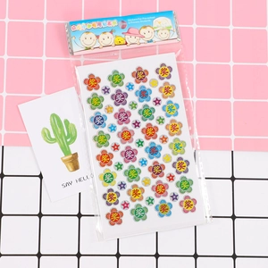 Detailed view of colorful flower and star reward stickers with glitter finish for children