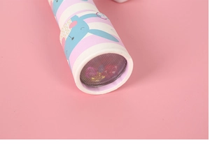 Close-up of a striped kaleidoscope with cartoon bunny illustration and colorful beads