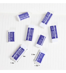 Close-up of white 2B erasers in purple sleeves with size measurements on paper