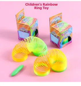 Detail of colorful gradient plastic rainbow spring toy with original cartoon packaging boxes