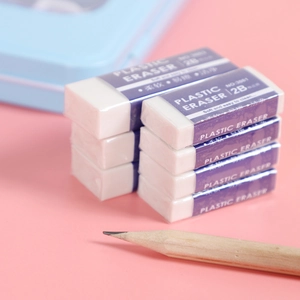 Set of 8 white 2B plastic erasers with purple sleeves on a pink background