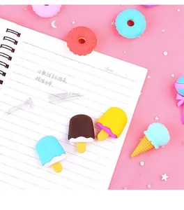 Detailed view of 3D dessert-shaped erasers including donuts and ice cream on pink sequins