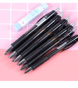 Macro detail of seven black gel pens with 0.5mm retractable tips and non-slip grips