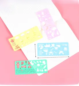 Detailed view of four colorful plastic drawing stencils measuring 14.5cm by 6.5cm each