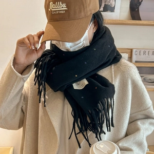 Chic black knitted scarf with colorful speckles and fringe tassel for winter warmth