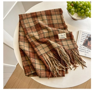 Close-up of vintage checkered tassel scarf with soft cashmere-like texture and brand label