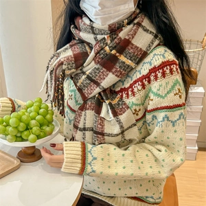 Classic colorful plaid tassel scarf for women paired with a vintage winter knit sweater