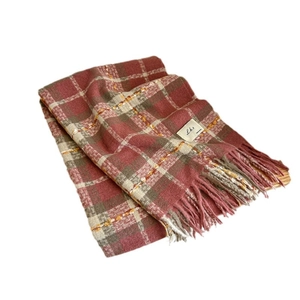 Colorful plaid tassel scarf with soft knit texture and woven label for winter warmth