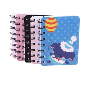 Set of four cute cartoon A7 spiral notebooks in blue, white, black and pink colors