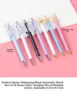 Detail view of colorful metal mechanical pencils with crown and bow decorative toppers