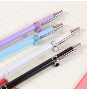 Set of four pastel bow-accented mechanical pencils in purple, blue, white, and black