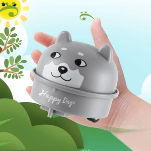 Detail of Shiba Inu pull-back toy car with Happy Days text in a hand-held display
