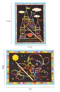 Detailed size comparison of two scratch art paper sets with wooden styluses and castle motifs