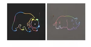 Detailed comparison showing vibrant rainbow colors vs standard matte on scratch art paper