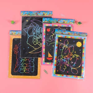 Rainbow scratch art paper set for kids with colorful cartoon patterns on pink background