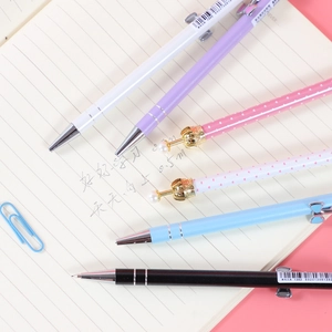 Assorted minimalist and decorative metal mechanical pencils on a lined notebook background