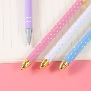 Set of four pastel metal mechanical pencils with heart patterns and gold accents