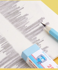 Close-up of blue anti-bacterial 2B eraser and pencil on bright yellow background