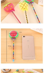 Detailed view of plush fruit-themed pens including strawberry and pineapple shapes