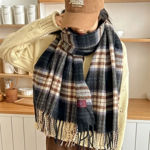 Plaid knitted scarf with fringe and brand label in navy and brown check pattern