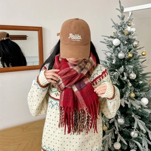 Christmas red plaid tassel scarf paired with a warm embroidered baseball cap and sweater