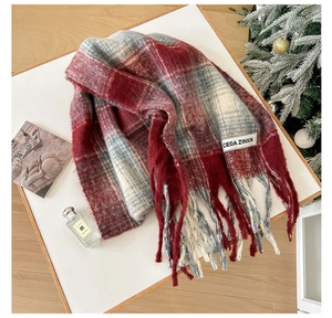 Detailed view of checkered mohair scarf with fringe and vintage aesthetic props