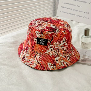 Double-sided bucket hat with Japanese red wave pattern and woven label branding