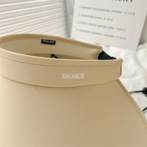 Beige wide brim open top sun hat with UALABCL logo for UV protection and outdoor sports