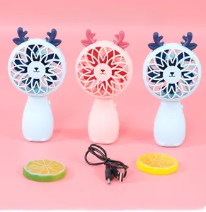 Detail of portable deer-shaped mini USB fans in pink and blue with charging cable