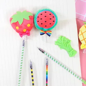 Cute plush fruit gel pens with strawberry watermelon pineapple designs on pink background