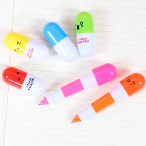 Cute capsule-shaped retractable ballpoint pens with cartoon faces in vibrant colors