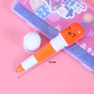 Cute retractable capsule ballpoint pen with cartoon face and vibrant orange design