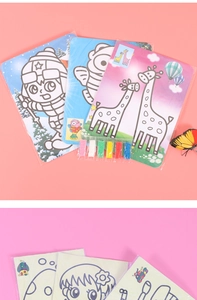 Macro detail of children's DIY sand art kit showing cartoon cards and 6 colored sand packets