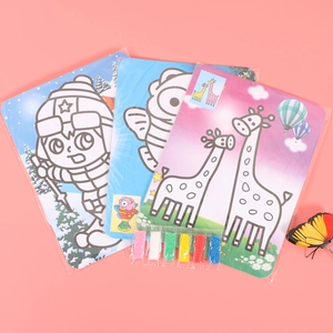 Kids DIY sand painting art kit with cartoon cards and colorful sand on pink background