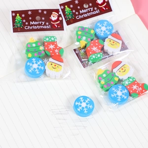 Christmas-themed eraser set with Santa and tree shapes in festive clear packaging
