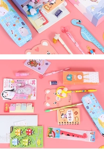Close-up of student stationery set with cartoon pencil case, animal rulers and notebooks