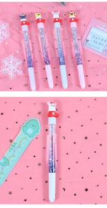 Detail of Christmas liquid quicksand pens with 3D cartoon animal characters and glitter