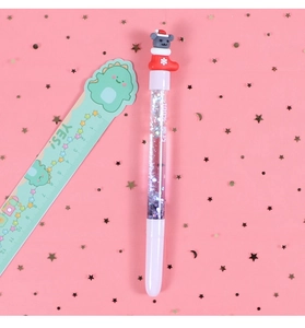 Detail showing a Christmas pen with liquid glitter and a cute cat in a stocking topper