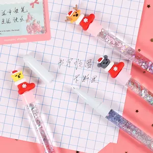 Christmas themed quicksand gel pen with cute deer and bear figures on pink background