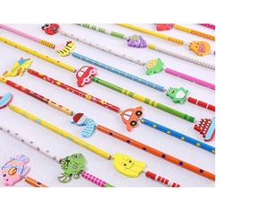 Detailed view of colorful cartoon wooden pencils featuring airplane and fruit toppers