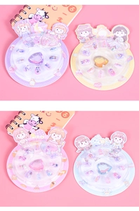 Detailed view of kids cartoon press-on nail sets with large heart gemstone decorations