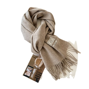 Classic 100% pure wool scarf in solid beige color with fringed edges and warm texture