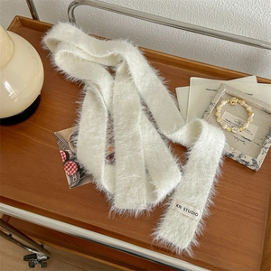 Plush white faux fur long scarf displayed on a wooden tray for autumn winter styling
