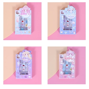 Close-up of four children's nail art sets with cute fruit and cartoon illustrations