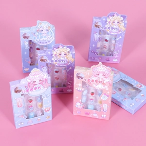 Set of colorful cartoon press-on nails for kids featuring strawberry and bunny patterns