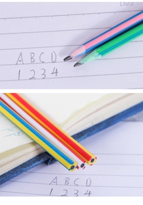 Detailed view of flexible striped pencils writing on a notebook with colorful patterns