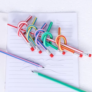 Flexible soft pencils with colorful stripes and erasers tied in knots on notebook paper